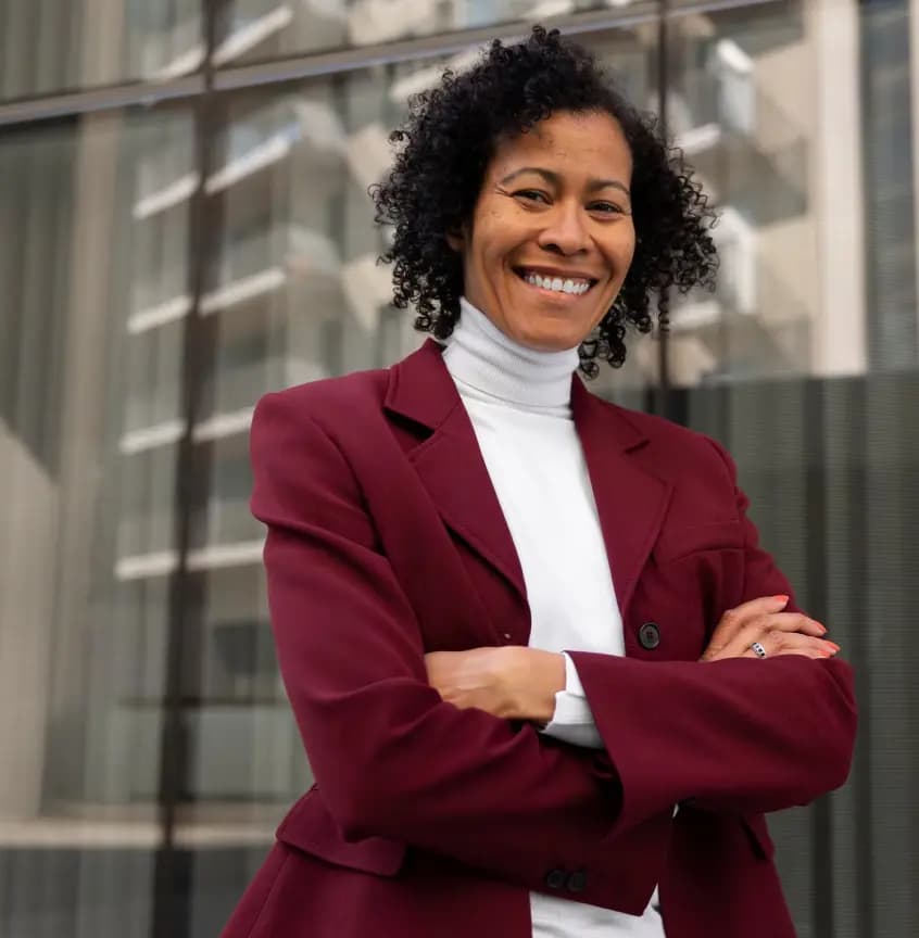 smiling woman with building in the background